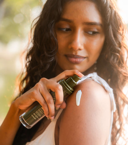 Applying Glowmonk sunscreen cream