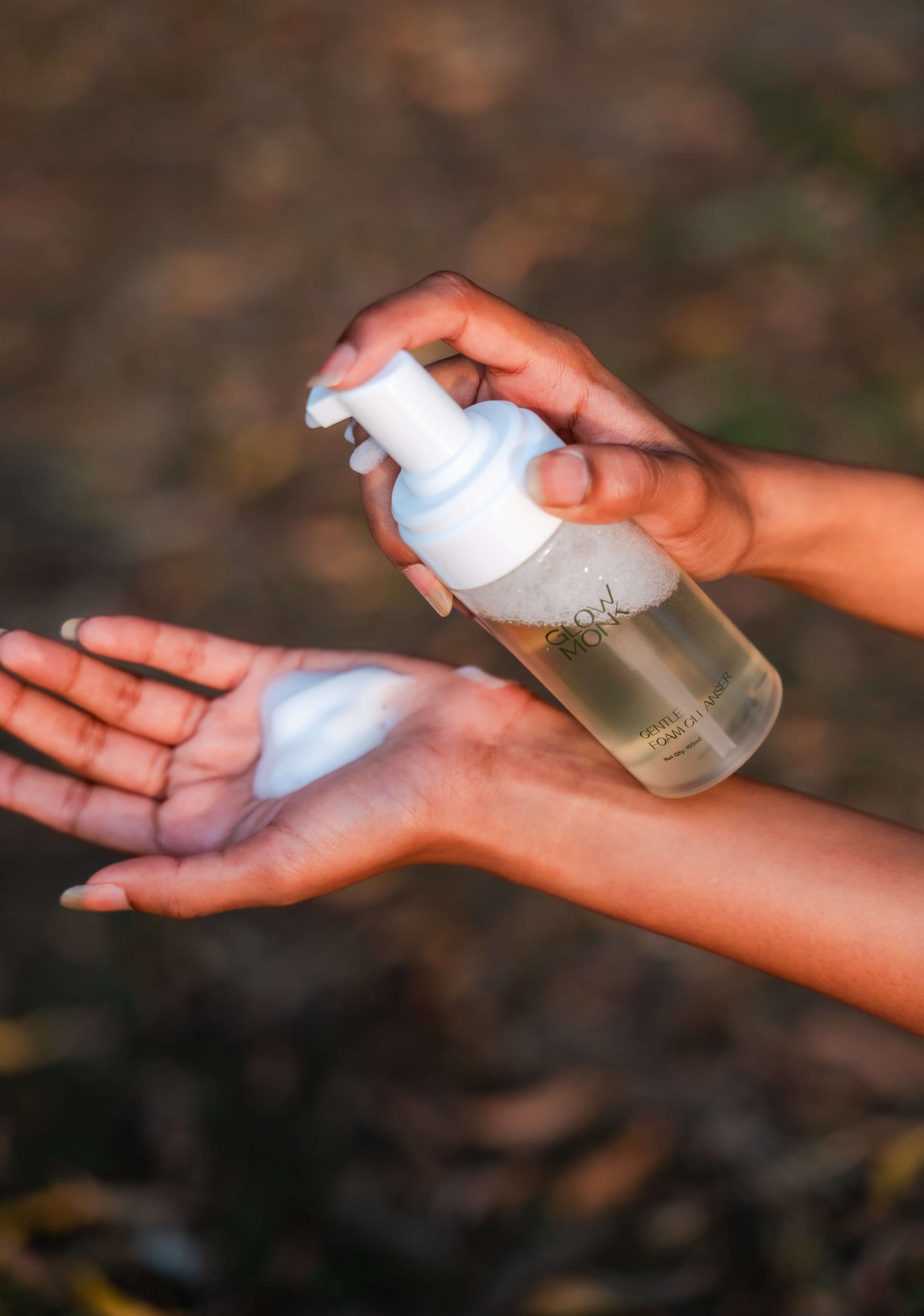 Applying Glowmonk foam cleanser